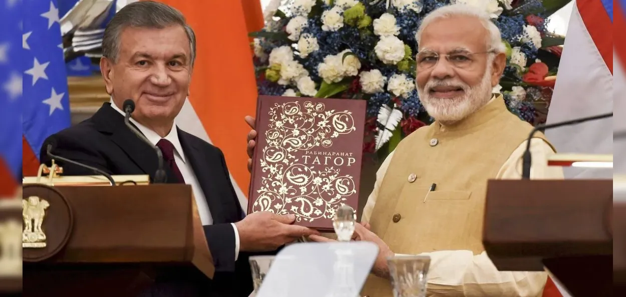 উজবেকিস্তানৰ ৰাষ্ট্ৰপতিৰ সৈতে ভাৰতৰ প্ৰধানমন্ত্ৰী মোদী (ফাইল ফটো)